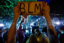 Demonstrators protest near the White House in Washington, June 4, 2020, over the death of George Floyd, a black man who died in police custody in Minneapolis.