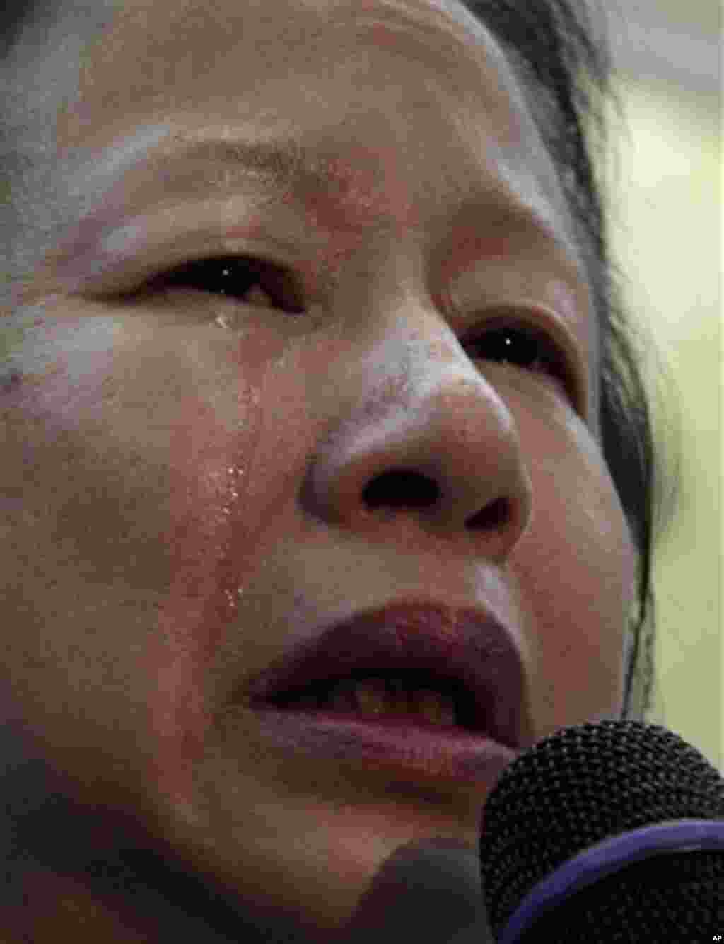Elizabeth OuYang, president of the New York chapter of the Organization of Chinese Americans, weeps as she speaks about the death of Pvt. Danny Chen during a news conference on Thursday, Jan. 5, 2012 in New York. An update was provided on a Pentagon inve