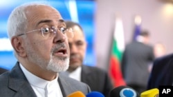 FILE - Iranian Foreign Minister Javad Zarif speaks with the media after a meeting in Brussels, May 15, 2018. 