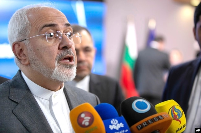 FILE - Iranian Foreign Minister Javad Zarif speaks with the media after a meeting with European Union foreign policy chief Federica Mogherini at the Europa building in Brussels, May 15, 2018.