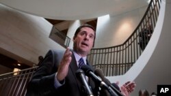 FILE - House Intelligence Committee Chairman Devin Nunes, R-Calif., left, speaks to reporters at the Capitol in Washington, March 24, 2017.