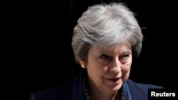 FILE - Britain's Prime Minister Theresa May leaves No. 10 Downing Street in London, May 23, 2018.