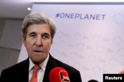 Former U.S. Secretary of State John Kerry talks to journalists during the One Planet Summit, near Paris, France, Dec. 12, 2017.