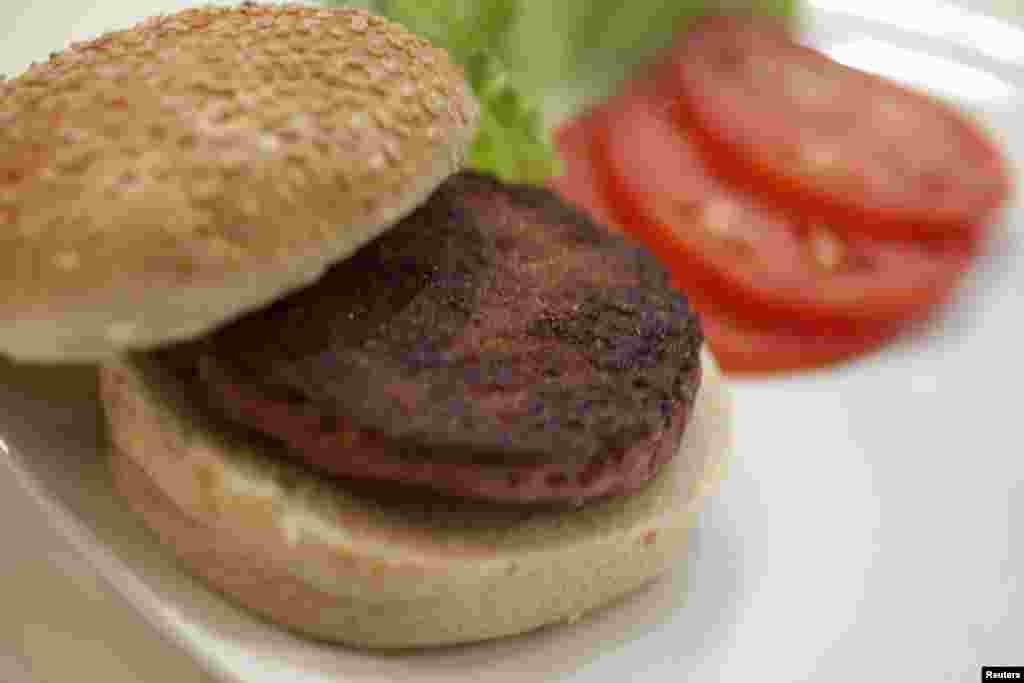 The world&#39;s first lab-grown beef burger is seen after it was cooked at a launch event in west London.