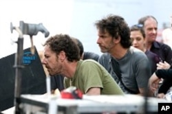 Left to right: Directors/Co-Writers Ethan and Joel Coen on the set of their film, TRUE GRIT.