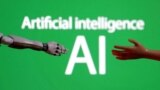 (FILE) Words reading "Artificial intelligence AI", miniature of robot and toy hand are pictured in this illustration taken December 14, 2023.