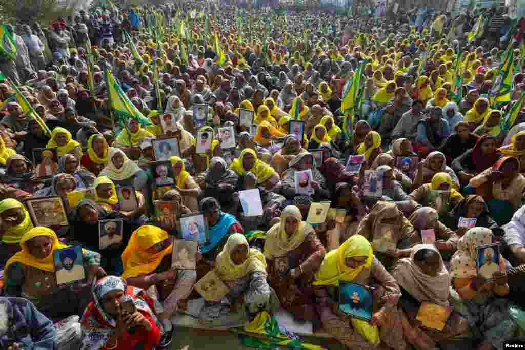 Women, including widows and relatives of farmers who were believed to have killed over debt, attend a protest against farm bills passed by India&#39;s parliament, at Tikri border near Delhi.