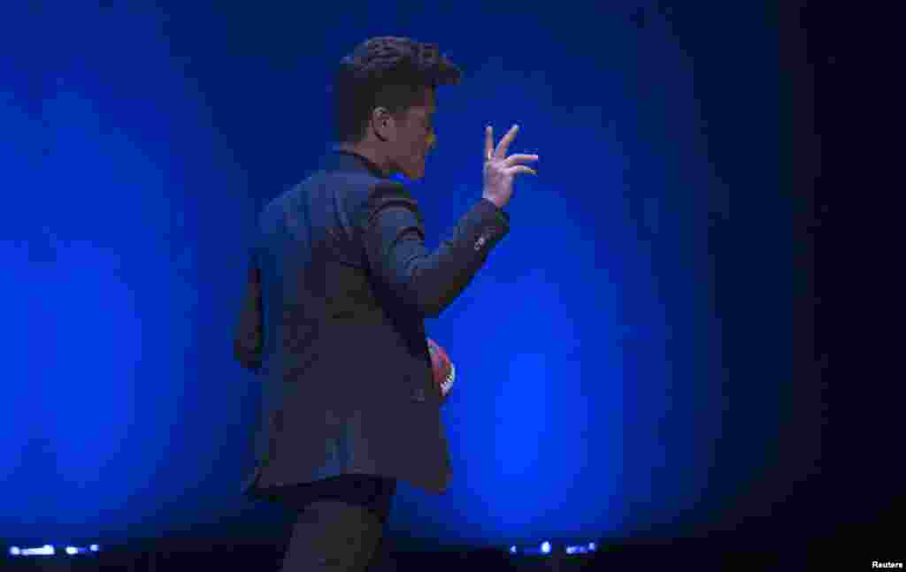 Singer Bruno Mars walks off the stage after the Super Bowl half time press conference in New York, Jan. 30, 2014.