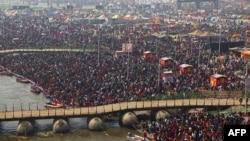 Pilgrims gather to take a holy dip at Sangam, the confluence of the Ganges, Yamuna and mythical Saraswati rivers, on the occasion of 'Mauni Amavasya' during the Maha Kumbh Mela festival in Prayagraj on Jan. 29, 2025.