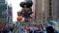The Ada Twist balloon moves down Sixth Avenue during the Macy's Thanksgiving Day Parade in New York, Thursday, Nov. 25, 2021
