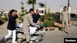 A tourist, who was injured in a stabbing, is rushed into King Hussein Medical Center in Amman, Jordan, Nov. 6, 2019. 