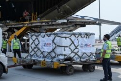 COVID-19 relief supplies from the U.S. are being unloaded from a U.S. Air Force aircraft at the Indira Gandhi International Airport's cargo terminal in New Delhi, India, April 30, 2021.