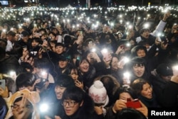 People attend a ceremony to celebrate the new year in Seoul, South Korea, Jan. 1, 2019.