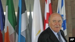FIFA President Sepp Blatter leaves after a news conference in Prague, February 8, 2011 (file photo)