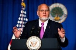 FILE - Then-Director of the Centers for Disease Control and Prevention Robert Redfield speaks during a White House Coronavirus Task Force briefing at the Department of Education building in Washington, July 8, 2020.