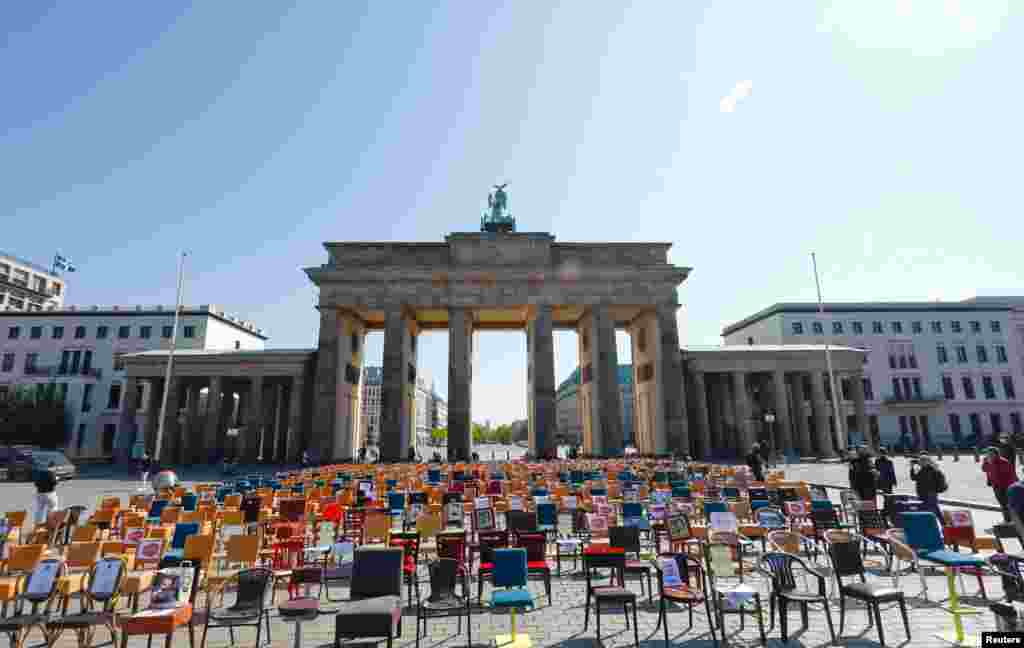 Empty chairs are placed in front of the Brandenburg gate to call attention to the difficult situation of hotel and restaurant owners, as the spread of the coronavirus disease (COVID-19) continues in Berlin, Germany. 