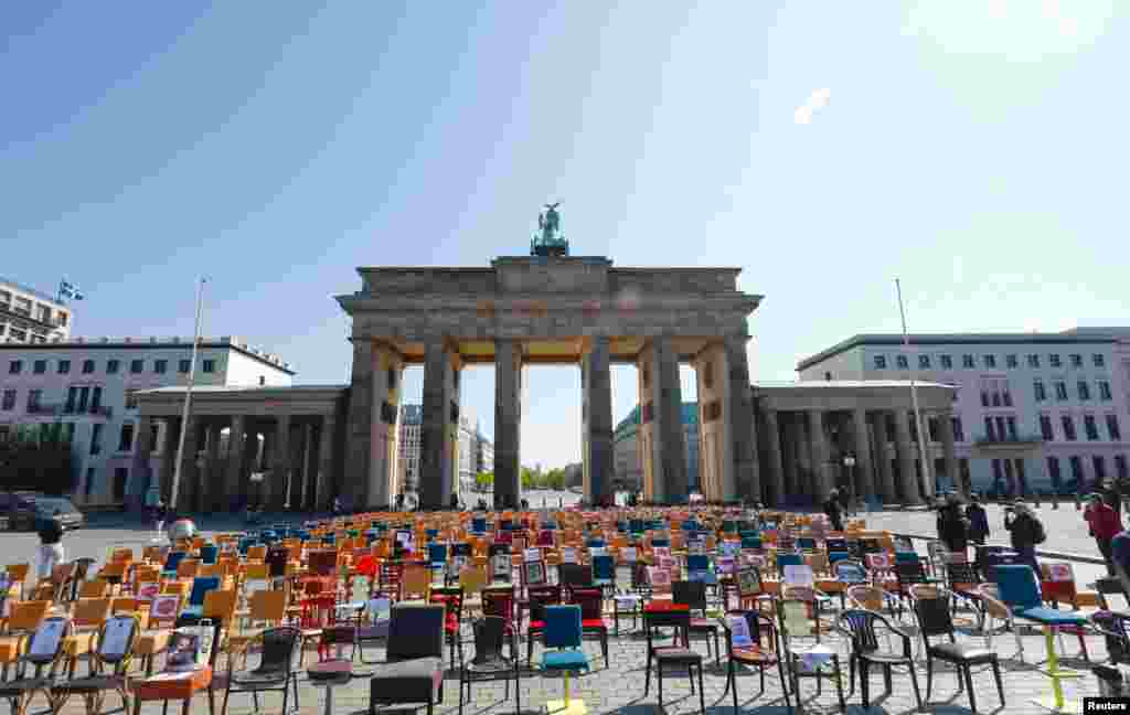 Empty chairs are placed in front of the Brandenburg gate to call attention to the difficult situation of hotel and restaurant owners, as the spread of the coronavirus disease (COVID-19) continues in Berlin, Germany.