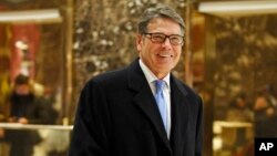 FILE - Former Texas Gov. Rick Perry smiles as he leaves Trump Tower in New York, Dec. 12, 2016. President-elect Donald Trump selected Perry to be secretary of energy, Dec, 14, 2016.