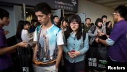 Students leave after a Scholastic Assessment Tests (SAT) exam at AsiaWorld-Expo in Hong Kong, Nov. 2, 2013.