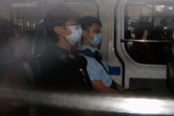 Former convenor of pro-independence group Studentlocalism, Tony Chung Hon-lam arrives at West Kowloon Magistrates‘ Courts in a police van after he was arrested under the national security law, in Hong Kong, China October 29, 2020.