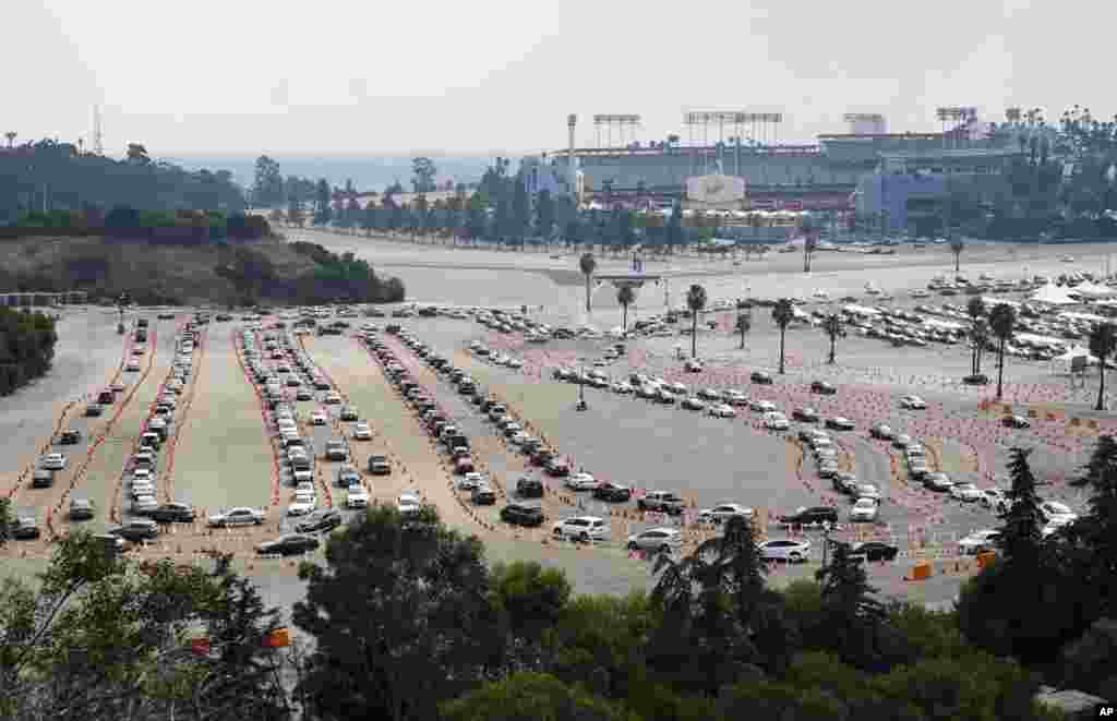 Motorists line up to receive a COVID-19 vaccine at a Los Angeles County location at Dodger Stadium in Los Angeles, California, Feb. 10, 2021.