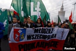 Far-right protesters march during the annual far-right rally, which coincides with Poland's National Independence Day in Warsaw, Poland, Nov. 11, 2014.