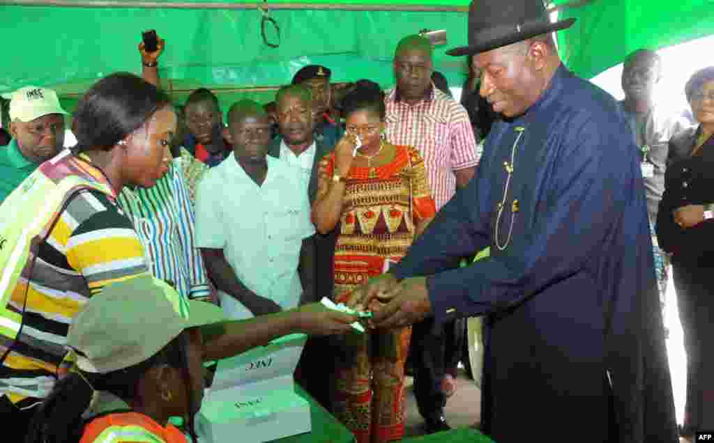 After weeks of delays over an Islamic insurgency, Nigerians head to the polls. Nigerian President Goodluck Jonathan registers to vote in Otuoke, March 28, 2015.