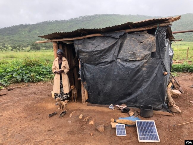 Takaitei Chigayo and her husband have been sleeping in a shelter of plastic sheeting with their four children after Zimbabwe’s government destroyed their home in 2015 to make way for former first lady Grace Mugabe’s game park, in Mazowe district, Zimbabwe, March 2, 2018. (S. Mhofu/VOA)