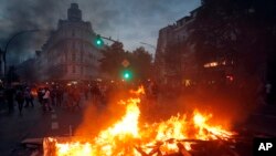 A barricade is set on fire during a protest against the G-20 summit in Hamburg, northern Germany, July 7, 2017. 