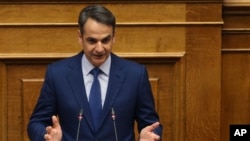 New Democracy party leader Kyriakos Mitsotakis addresses lawmakers during a parliamentary session where he submitted a motion of no confidence against Prime Minister Alexis Tsipras, in Athens, June 14, 2018.