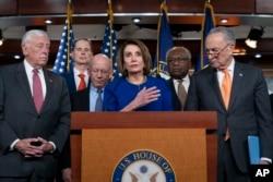 Speaker of the House Nancy Pelosi, Senate Minority Leader Chuck Schumer, and other congressional leaders react to a failed meeting with President Donald Trump, at the Capitol in Washington, May 22, 2019.