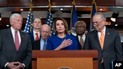 Speaker of the House Nancy Pelosi, Senate Minority Leader Chuck Schumer, and other congressional leaders react to a failed meeting with President Donald Trump, at the Capitol in Washington, May 22, 2019.