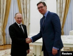 FILE - Russian President Vladimir Putin shakes hands with Serbian Prime Minister Aleksandar Vucic during their meeting at the Kremlin in Moscow, Russia, March 27, 2017.