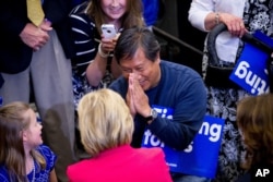 A supporter in the crowd greets Democratic presidential candidate Hillary Clinton during a get out the vote event at Transylvania University in Lexington, Kentucky, May 16, 2016.