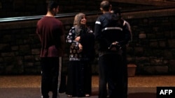 A Muslim family waits outside a hospital after a shooting in Christchurch, March 15, 2019. Attacks on two Christchurch mosques left at least 49 dead.