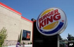 FILE - This April 25, 2019, file photo shows a Burger King in Redwood City, Calif. Burger King is announcing its work to help address a core industry challenge: the environmental impact of beef. To help tackle this environmental issue, the Burger King br