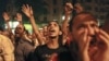 Protesters shout during a demonstration against presidential candidates Mohamed Morsi and Ahmed Shafiq at Tahrir Square in Cairo May 28, 2012.