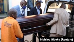 South Africa undertakers load a casket on a hearse