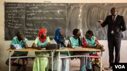 These students will help lead money savings and loaning groups in their classrooms. (Photo: Chika Oduah for VOA) 