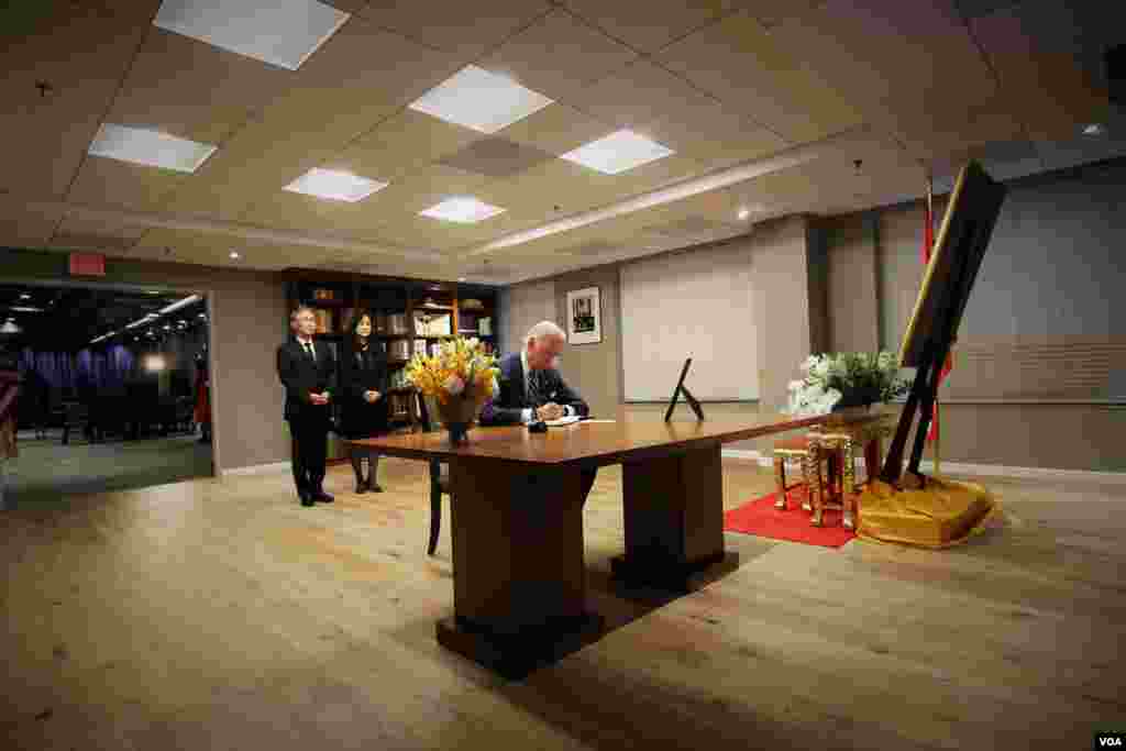 Vice President Joe Biden signs a book of condolences for His Majesty King Bhumibol Adulyadej