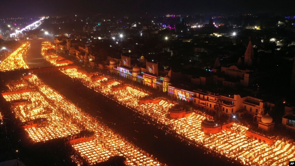 People light lamps on the banks of the river Saryu in Ayodhya, India, Wednesday, Nov. 3, 2021. Millions of people across Asia are celebrating the Hindu festival of Diwali, which symbolizes new beginnings and the triumph of good over evil and light over da