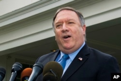 FILE - U.S. Secretary of State Mike Pompeo speaks to reporters outside the White House in Washington, Oct. 9, 2018.