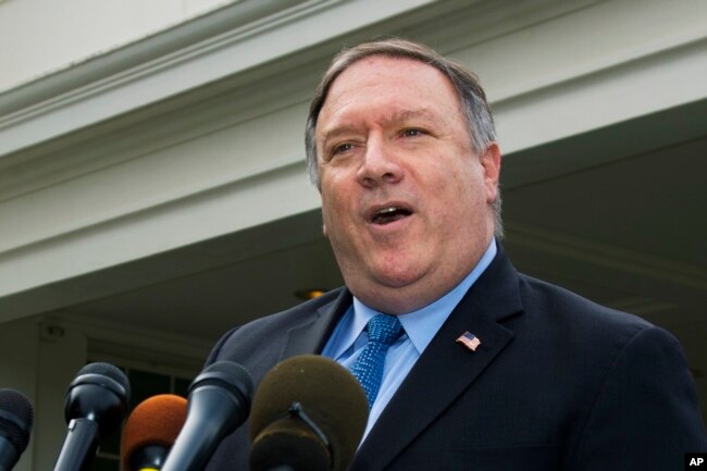 U.S. Secretary of State Mike Pompeo speaks to reporters outside the White House in Washington, Oct. 9, 2018.