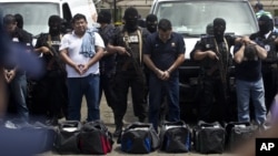 Nicaragua National Police present 18 foreigners believed to be Mexican nationals who posed as Televisa journalists, in Managua, Nicaragua, August 24, 2012. 