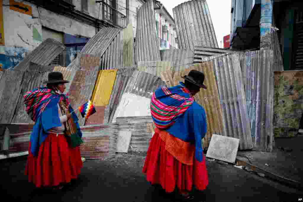 Supporters of former President Evo Morales march to the presidential palace in La Paz, Bolivia. Morales resigned and flew to Mexico under military pressure following massive nationwide protests over alleged fraud.