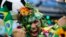 A Brazil soccer fan covered in flowers and his nation's flag cheers inside the FIFA Fan fest area before the start of the World Cup openes between Brazil and Croatia on Copacabana beach, Rio de Janeiro, Brazil, June 12, 2014.