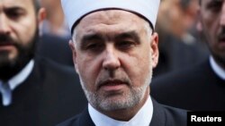 FILE - New elected Grand Mufti of Bosnia Husein Kavazovic arrives at an inauguration ceremony in front of the Gazi Husrev Begova mosque in Sarajevo, Nov. 15, 2012. Kavazovic is the 14th Grand Mufti of the Islamic Community in Bosnia and Herzegovina. 