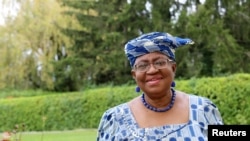 FILE - Ngozi Okonjo-Iweala poses outside a Nigerian diplomatic residence in Chambesy, near Geneva, Switzerland, Sept. 29, 2020. 