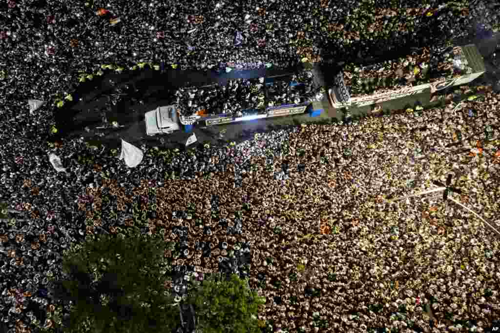 Players of Brazil's Botafogo parade through the streets on a truck during a homecoming celebration after winning the Copa Libertadores soccer tournament, in Rio de Janeiro, Dec. 1, 2024.