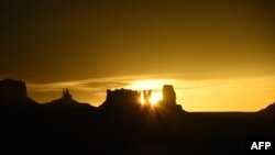 The sun rises over the Monument Valley on April 19, 2018. The region is part of the Colorado Plateau and lies within the territory of the Navajo Nation Reservation.